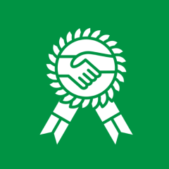 Handshake emblem with laurel and ribbons.